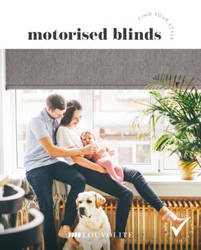 Modern motorised blinds installed in a bright living room with family and dog.