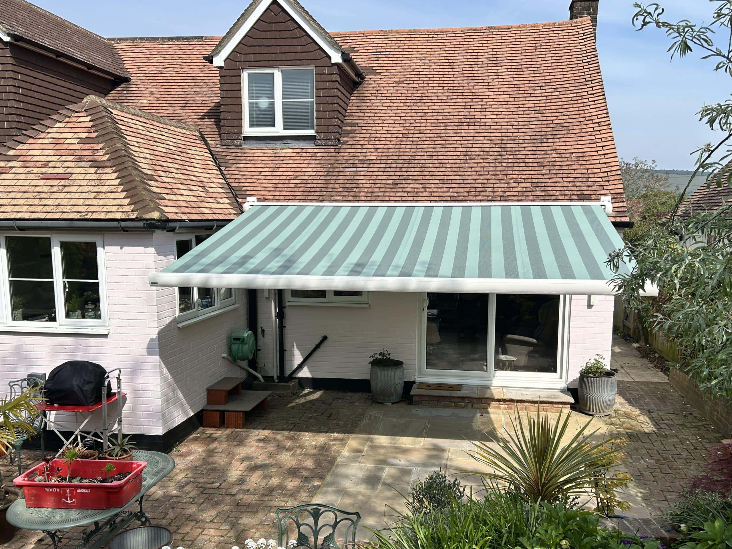 Retractable patio awning by Sovereign Shading Systems providing outdoor shade and weather protection.