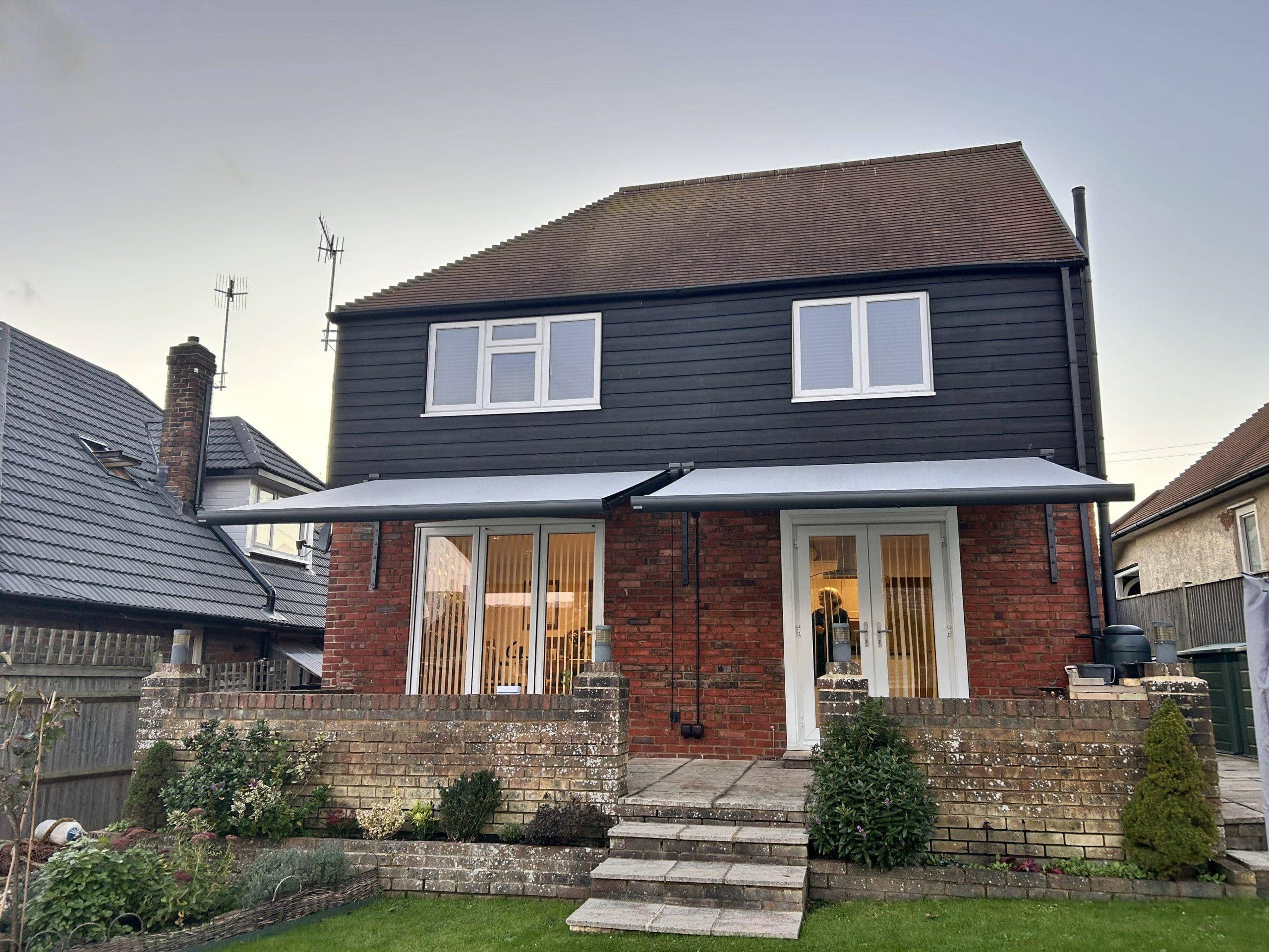 High-quality shading system installed on a residential home, enhancing outdoor comfort and energy ef.