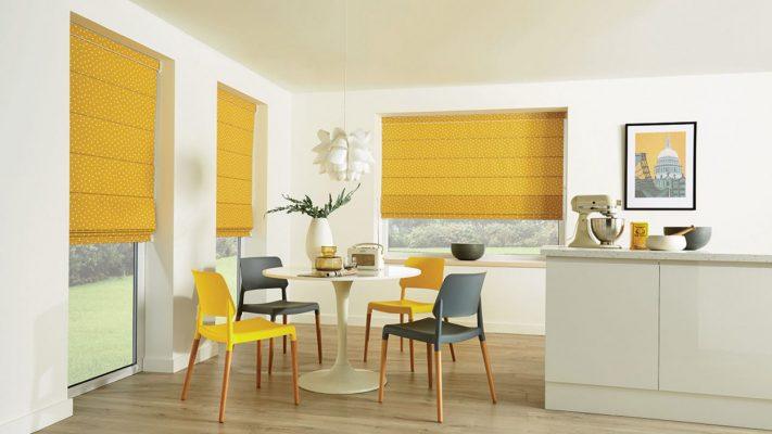 Modern yellow window blinds in a bright, contemporary dining area.