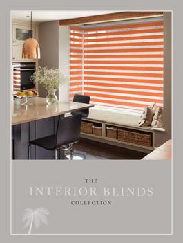 Modern interior blinds with orange and white stripes for stylish shading solutions.