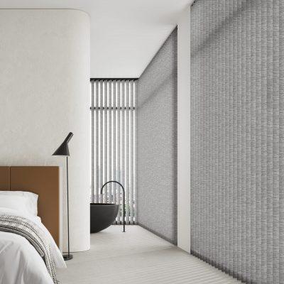 Contemporary shading system in a minimalist bedroom with textured wall coverings.