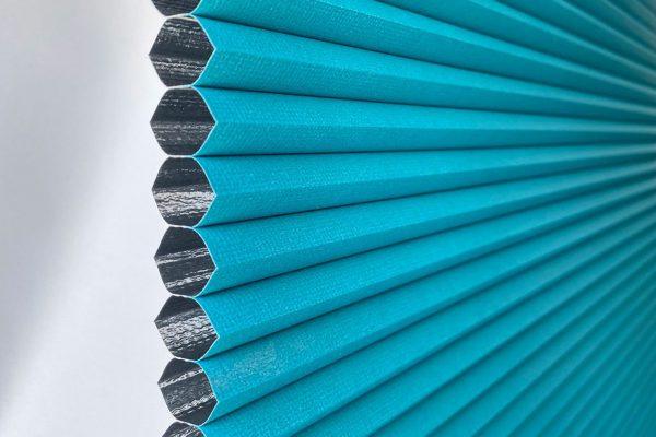 Durable blue external shading system for sun protection and privacy.