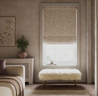 Modern window with patterned roller blind and cozy bench in a stylish room.