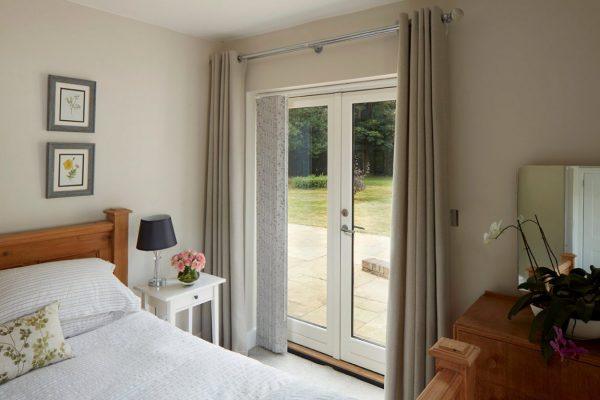 Modern patio door with Sovereign shading system for enhanced privacy and light control.