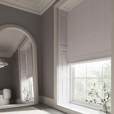 Elegant window with modern roller blind from Sovereign Shading Systems, enhancing interior style and.