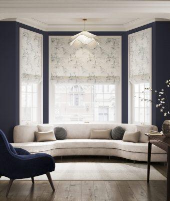 Elegant window shading system with patterned blinds in a stylish living room.