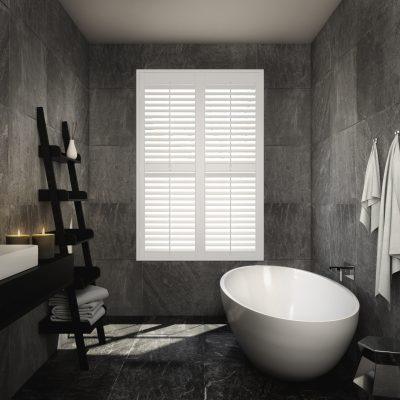 Modern bathroom with white window shutters and sleek decor.