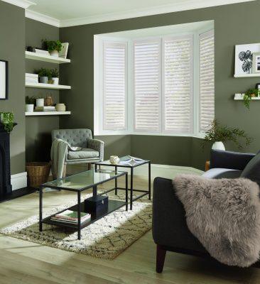 Elegant window shutters providing light control and privacy in a contemporary home.