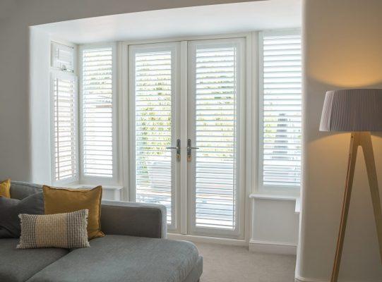 High-quality window shutters with adjustable slats for light control and privacy. Perfect for modern.