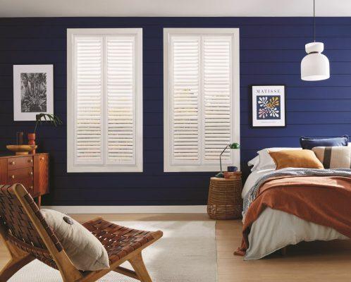 Elegant white plantation shutters for stylish window shading solutions.