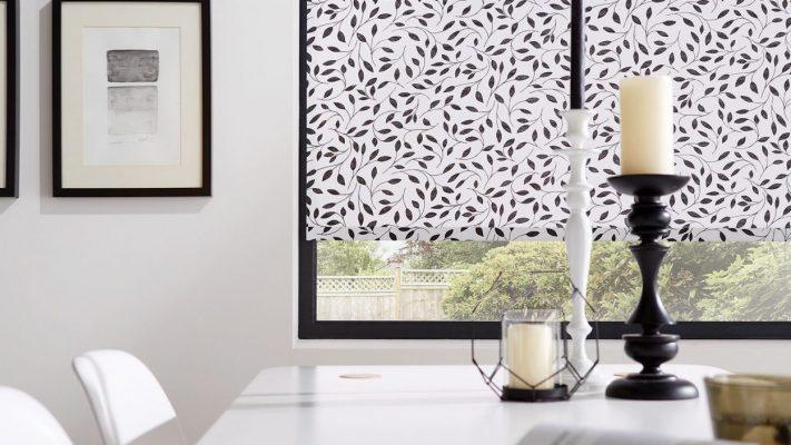 Elegant window blinds with leaf pattern for stylish shading solutions.