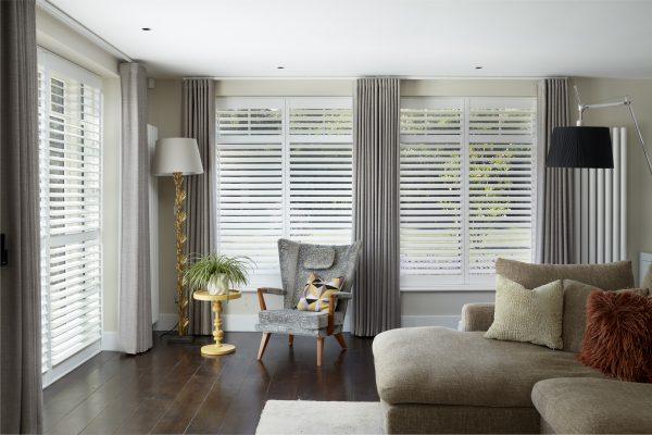 Elegant interior with custom-made window shutters and blinds by Sovereign Shading Systems.