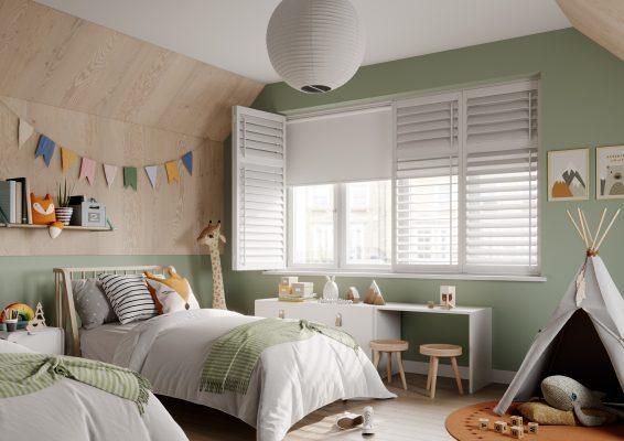 Children's bedroom with green walls, window shutters, and playful decor.