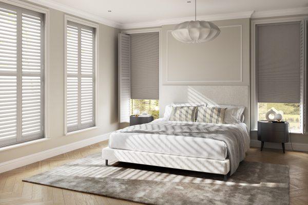 Elegant bedroom with modern shading solutions from Sovereign Shading Systems.
