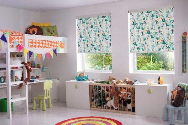 Bright, playful children's room with patterned window blinds by Sovereign Shading Systems.