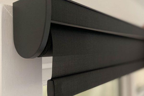 Outdoor black shading blinds for sun protection and privacy.