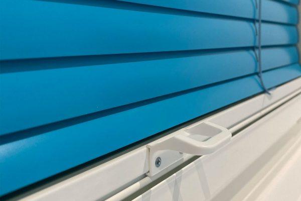 Blue window shutters with secure locking mechanism for shading solutions.
