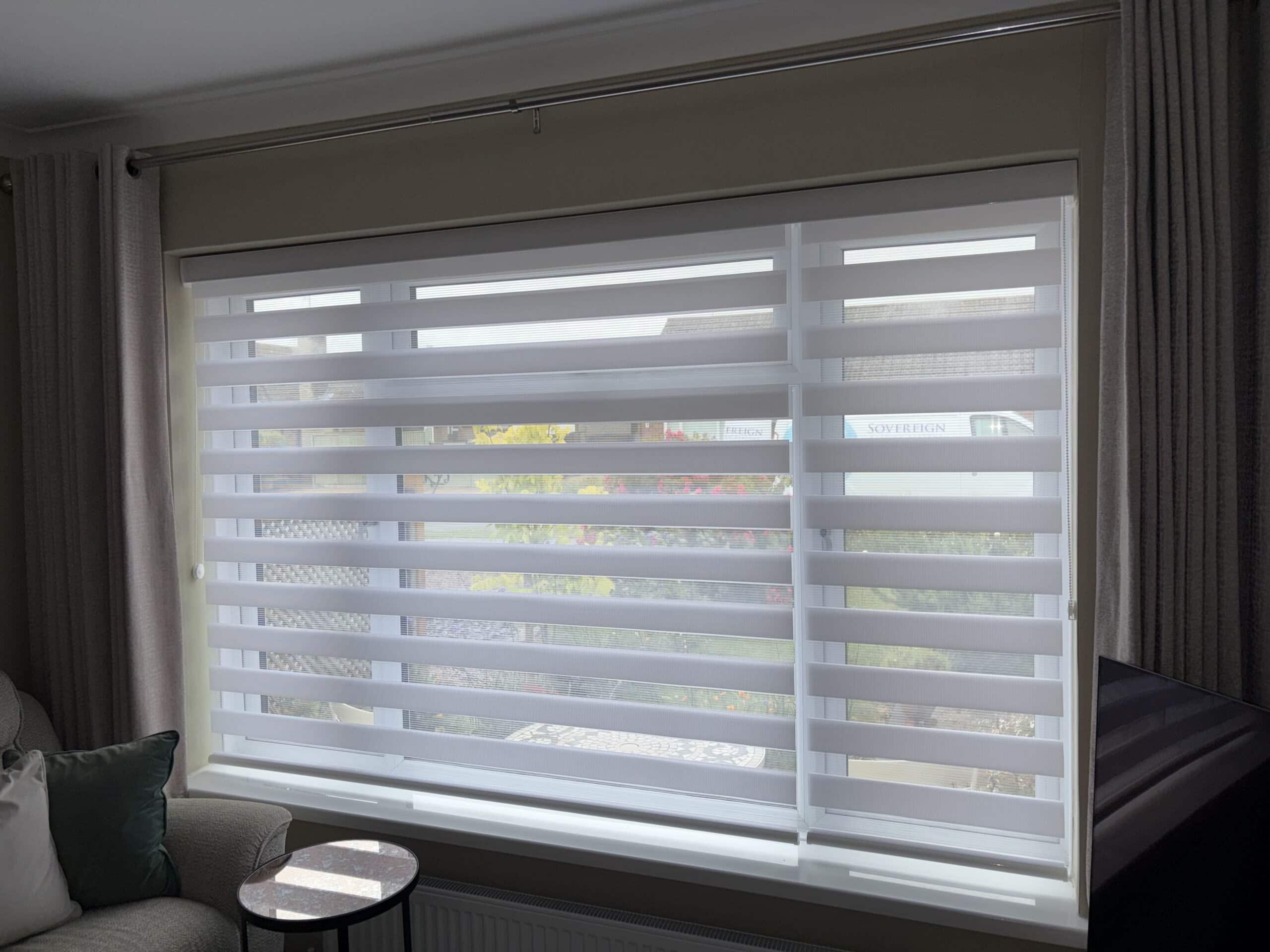 Modern zebra blinds installed in a living room for light control.